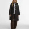 Barbour x GANNI Peplum lång quiltad jacka Barbour x GANNI Peplum lång quiltad jacka